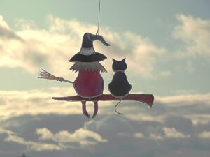 Hanging Suncatcher Witch with Black Cat stained glass is a unique handmade decor, a great idea for an Halloween, birthday and Christmas gift. Also, this cute miniature art can decorate your the window and wall in your home and garden outdoor decor.