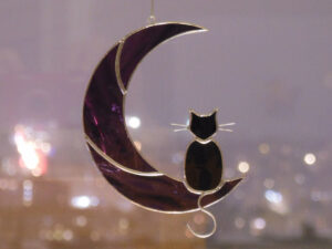 Hanging Suncatcher Black Cat On Purple Moon stained glass window is a unique handmade decor, idea for birthday and Christmas gift for an animal lover. This cute miniature art can decorate your home and garden outdoor decor, and pet loss memorial.