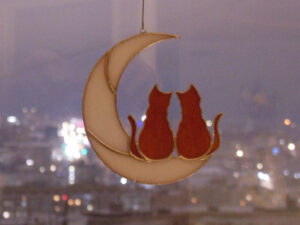 Hanging Suncatcher 2 Ginger Cats On Moon stained glass is a unique handmade decor, idea for Christmas gift for animal lover. This cute art miniature can decorate your the window and wall in your home and garden outdoor decor, and pet loss memorial.